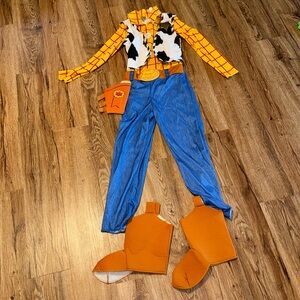 Toy Story woody costume with badge and shoe covers. Hat and bandana not included